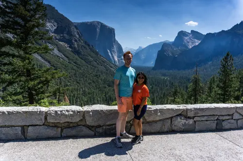 Minerva and Samuel taking in the majestic views of Yosemite Valley with Half Dome in the background.