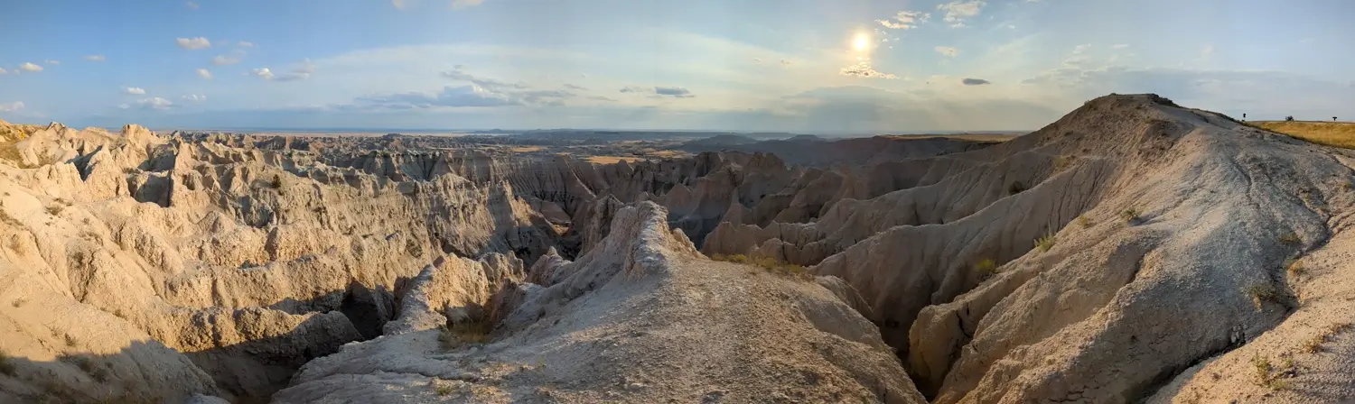 Ancient Hunters Overlook Panorama Of Badlands Wide panorama of the heavily eroded rock formations and steep ravines at Ancient Hunters Overlook in Badlands National Park.