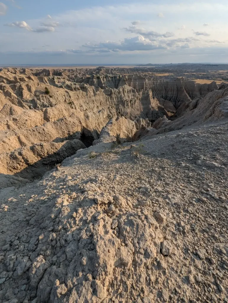Deep canyon view of the Badlands formations from the Ancient Hunters Overlook, showing rugged, eroded earth and rock.